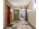 Building hallway with red and neutral colored apartment doors at 400 17Th Nw St # 2118, Atlanta, GA 30363