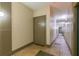 Building hallway with neutral colored doors and tile flooring at 400 17Th Nw St # 2118, Atlanta, GA 30363