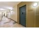 Building hallway with dark teal apartment doors and tile flooring at 400 17Th Nw St # 2118, Atlanta, GA 30363