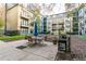 Community courtyard with patio furniture and grill at 400 17Th Nw St # 2118, Atlanta, GA 30363