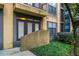 Ground level condo entrance with ramp access and lush landscaping at 400 17Th Nw St # 2118, Atlanta, GA 30363