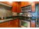 Modern kitchen with stainless steel appliances and dark wood cabinets at 400 17Th Nw St # 2118, Atlanta, GA 30363
