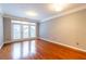Bright living room with hardwood floors and access to a private patio at 400 17Th Nw St # 2118, Atlanta, GA 30363