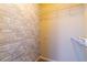 Large walk-in closet with wire shelving and brick wallpaper at 400 17Th Nw St # 2118, Atlanta, GA 30363
