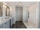 Spa-like bathroom with a large walk-in shower and double vanity at 5060 Lloyd Ln, Cumming, GA 30040