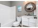 Modern bathroom with white vanity, marble countertop and decorative mirror at 5060 Lloyd Ln, Cumming, GA 30040