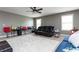 Bright bonus room with a sectional sofa, and ample space for entertainment at 5060 Lloyd Ln, Cumming, GA 30040