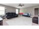 Spacious bonus room featuring a large sectional sofa and plenty of natural light at 5060 Lloyd Ln, Cumming, GA 30040