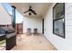 Covered patio with ceiling fan, grill, and lounge chairs at 5060 Lloyd Ln, Cumming, GA 30040