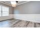 Formal dining room with hardwood floors and wainscoting at 5060 Lloyd Ln, Cumming, GA 30040