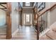 Bright and spacious entryway with wooden beams, and hardwood floors at 5060 Lloyd Ln, Cumming, GA 30040