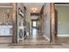 Long hallway with hardwood floors and wooden accents at 5060 Lloyd Ln, Cumming, GA 30040