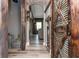 Long hallway with rustic barn door and wood flooring at 5060 Lloyd Ln, Cumming, GA 30040