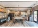 Large kitchen with granite island, exposed beams, and stainless steel appliances at 5060 Lloyd Ln, Cumming, GA 30040