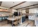 Farmhouse-style kitchen with granite countertops and exposed wooden beams at 5060 Lloyd Ln, Cumming, GA 30040
