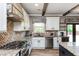 Bright kitchen featuring stainless steel appliances and a herringbone backsplash at 5060 Lloyd Ln, Cumming, GA 30040
