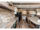 Rustic kitchen features exposed brick, wood countertops and open shelving at 5060 Lloyd Ln, Cumming, GA 30040