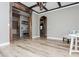 Light-filled living room with hardwood floors and exposed beams at 5060 Lloyd Ln, Cumming, GA 30040