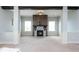 Spacious living room featuring a fireplace and built-in shelving at 5060 Lloyd Ln, Cumming, GA 30040