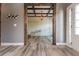 Open living area with white shiplap walls and a wood beam ceiling at 5060 Lloyd Ln, Cumming, GA 30040
