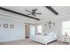 Main bedroom with sliding barn door and ceiling fan at 5060 Lloyd Ln, Cumming, GA 30040