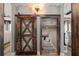 Charming playroom with a rustic barn door and built-in reading nook at 5060 Lloyd Ln, Cumming, GA 30040