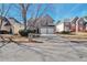 Two-story house with a three-car garage and manicured lawn at 184 Hawken Trl, Mcdonough, GA 30253