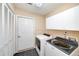 Practical laundry room with modern appliances and ample storage cabinets at 2191 Rockbridge Sw Rd # 202, Stone Mountain, GA 30087