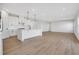 Modern kitchen with white cabinets, island, and stainless steel appliances at 328 Meuse Ln, Locust Grove, GA 30248