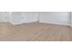 Light hardwood floors in a spacious living room at 328 Meuse Ln, Locust Grove, GA 30248