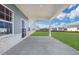 Covered patio with concrete flooring and access to backyard at 328 Meuse Ln, Locust Grove, GA 30248