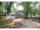 Spacious backyard with large trees and a wooden fence at 1574 Mayflower St, Atlanta, GA 30311