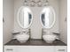Double vanity bathroom with granite countertop and vessel sinks at 1574 Mayflower St, Atlanta, GA 30311