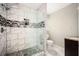 Modern bathroom with a glass shower and marble tile at 1574 Mayflower St, Atlanta, GA 30311