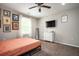 Bright bedroom featuring a queen bed, dresser, and wall art at 1574 Mayflower St, Atlanta, GA 30311