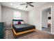 Cozy bedroom with a queen bed and ceiling fan at 1574 Mayflower St, Atlanta, GA 30311