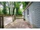 Wooden deck overlooks backyard with mature trees at 1574 Mayflower St, Atlanta, GA 30311