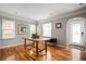Dining room with hardwood floors, large windows, and a wooden table at 1574 Mayflower St, Atlanta, GA 30311