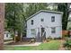 Two-story house with gray siding, a landscaped yard, and walkway at 1574 Mayflower St, Atlanta, GA 30311