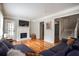 Open living room with hardwood floors, fireplace and access to staircase at 1574 Mayflower St, Atlanta, GA 30311