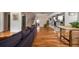 Living room with hardwood floors, open concept design, and kitchen view at 1574 Mayflower St, Atlanta, GA 30311