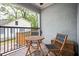 Private patio with brick wall and small table and chairs at 1574 Mayflower St, Atlanta, GA 30311