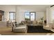 Open concept living room featuring floor to ceiling windows, modern furnishings and chef's kitchen at 318 Sandy Springs Cir # 260, Sandy Springs, GA 30328