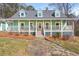 Charming home featuring a covered front porch, dormer windows, and a stone walkway at 3944 New Hope Church Se Rd, Acworth, GA 30102