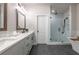 Modern bathroom with dual sinks, a spacious shower, and elegant fixtures at 418 Townly, Alpharetta, GA 30009