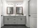 Modern bathroom featuring double vanity with square framed mirrors, gray cabinets, and black hardware at 418 Townly, Alpharetta, GA 30009