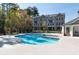 Community pool with sundeck and nearby clubhouse, perfect for relaxation and recreation at 418 Townly, Alpharetta, GA 30009