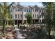 Brick townhomes with elegant entryways and manicured landscaping create an inviting curb appeal at 418 Townly, Alpharetta, GA 30009