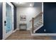 Welcoming foyer featuring a staircase, a side table, and luxury vinyl flooring at 418 Townly, Alpharetta, GA 30009
