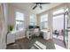 Bright home office with dual monitors, an open door to a patio, and two large windows at 418 Townly, Alpharetta, GA 30009